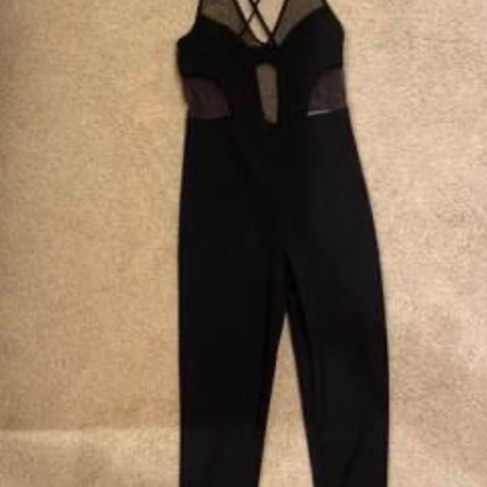 Black jumper with mesh detailing. Size medium. Fits like a small